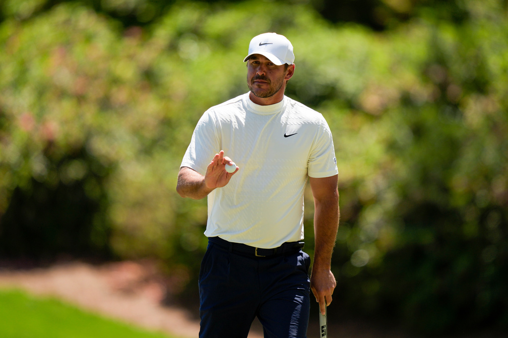 Brooks Koepka waves after his putt on the 13th hole during the second round of the Masters golf tournament at the Augusta National Golf Club, Friday, April 10, 2026, in Augusta, Ga. (AP Photo/Matt Slocum)