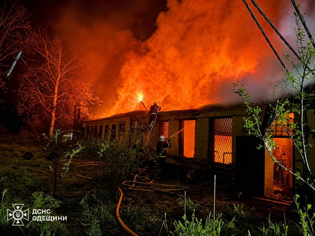 In this photo provided by the Ukrainian Emergency Service, firefighters put out a fire a building following a Russian drone attack in Odesa region, Ukraine, Saturday, May 2, 2026. (Ukrainian Emergency Service via AP)