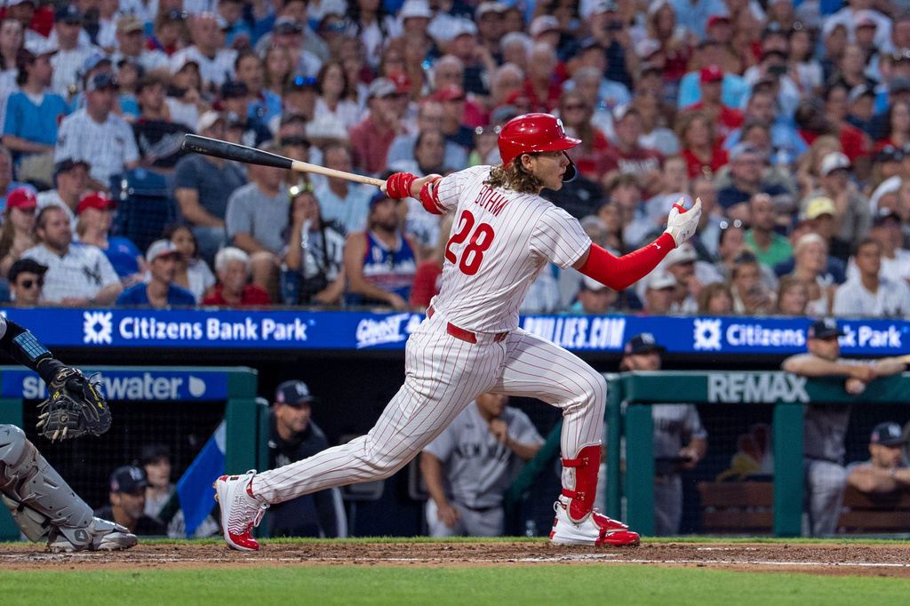 Philadelphia Phillies' Alec Bohm hits a three run double during the third inning of a baseball game against the New York Yankees, Sunday, July 26, 2026, in Philadelphia. (AP Photo/Chris Szagola)
