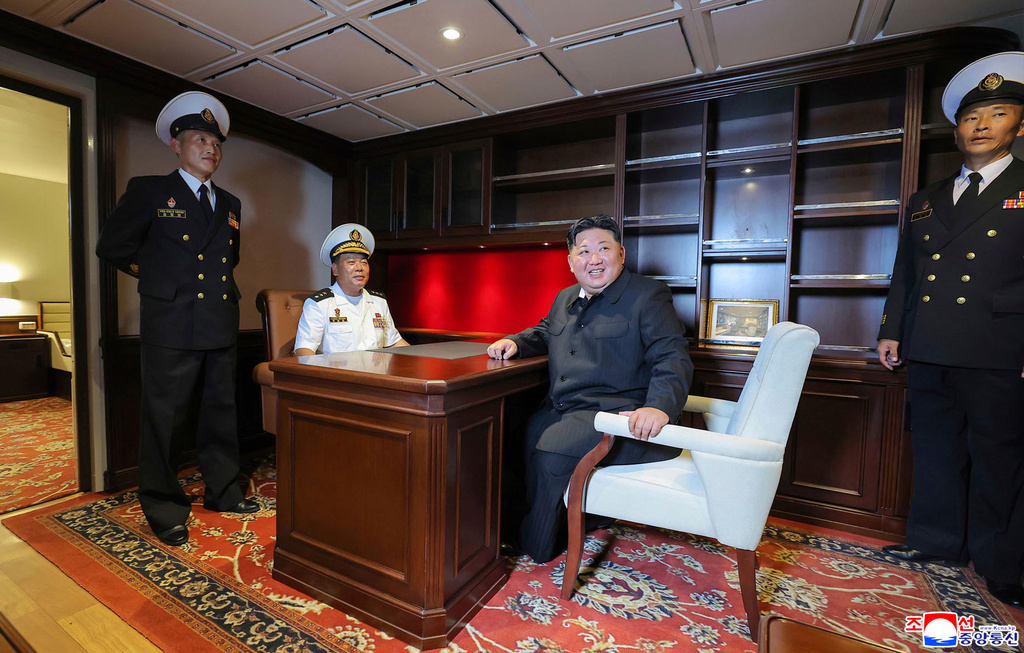 In this photo provided by the North Korean government, North Korean leader Kim Jong Un, center right, inspects the warship Choe Hyon in Nampo, North Korea, on Aug. 18, 2025. Independent journalists were not given access to cover the event depicted in this image distributed by the North Korean government. The content of this image is as provided and cannot be independently verified. Korean language watermark on image as provided by source reads: "KCNA" which is the abbreviation for Korean Central News Agency. (Korean Central News Agency/Korea News Service via AP)