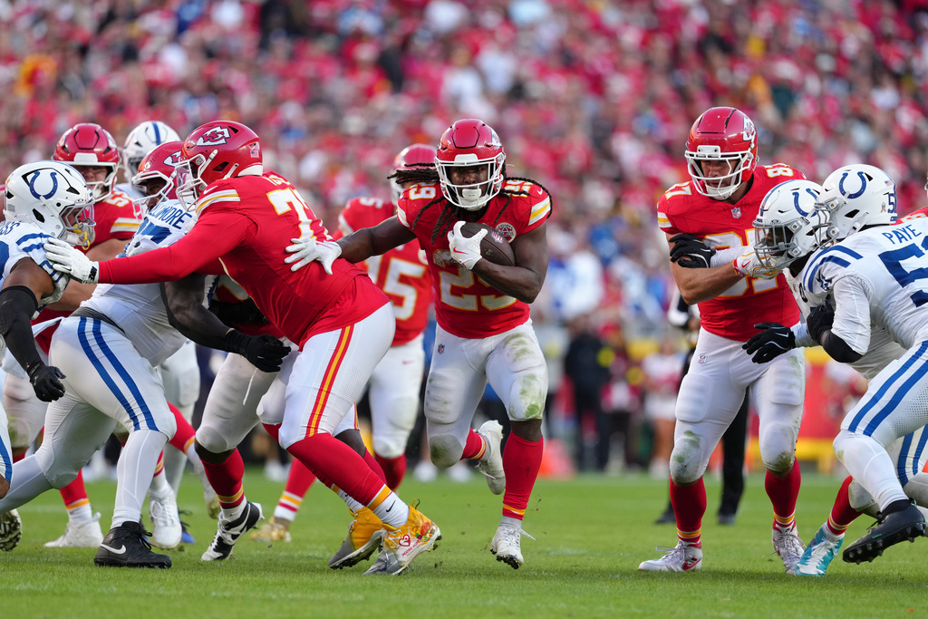 Kansas City Chiefs running back Kareem Hunt (29) runs for a first down against the Indianapolis Colts during overtime of an NFL football game Sunday, Nov. 23, 2025, in Kansas City, Mo. (AP Photo/Ed Zurga)