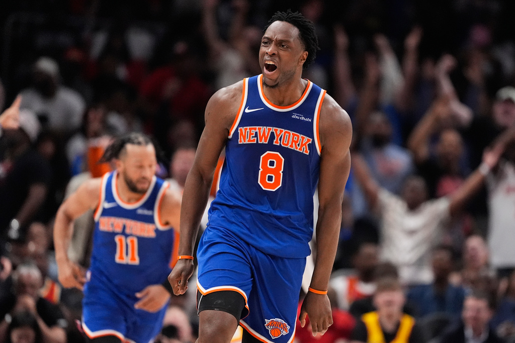 New York Knicks forward Og Anunoby (8) reacts after scoring during the first half of Game 4 in a first-round NBA playoffs basketball series against the Atlanta Hawks Saturday, April 25, 2026, in Atlanta. (AP Photo/Brynn Anderson)