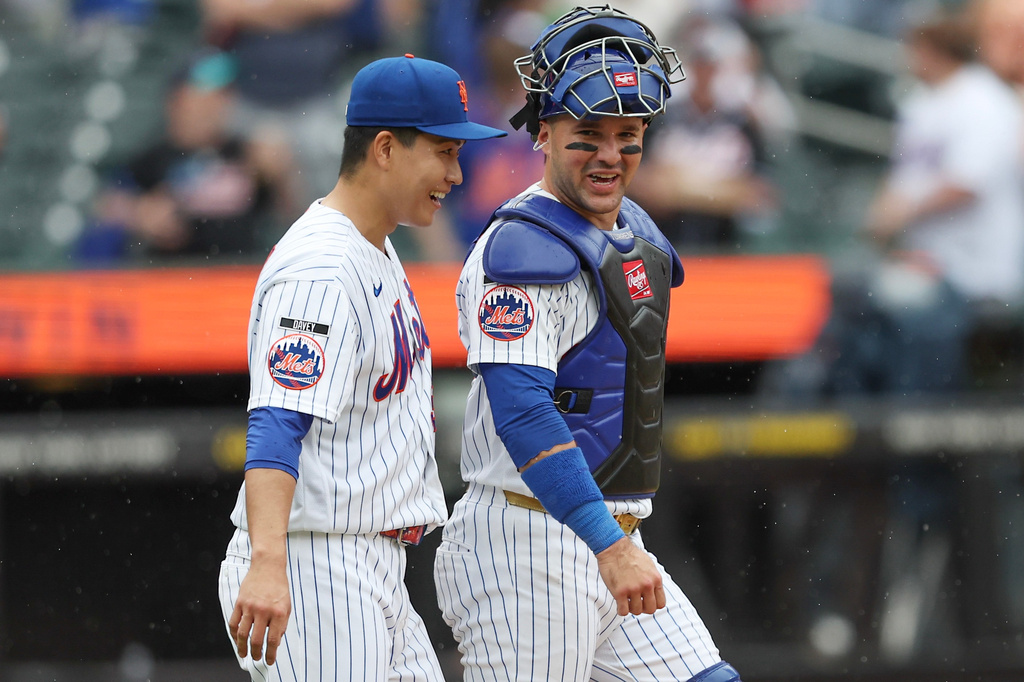 New York Mets pitcher Kodai Senga and catcher Luis Torrens smile after a win over the Washington Nationals in the ninth inning of a baseball game, Sunday, Aug. 16, 2026, in New York. (AP Photo/Heather Khalifa)