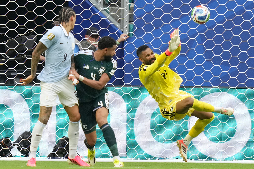 Saudi Arabia goalkeeper Mohammed Alowais stops a shot during a World Cup Group H soccer match against Uruguay in Miami Gardens, Fla., Monday, June 15, 2026. (AP Photo/Lynne Sladky)