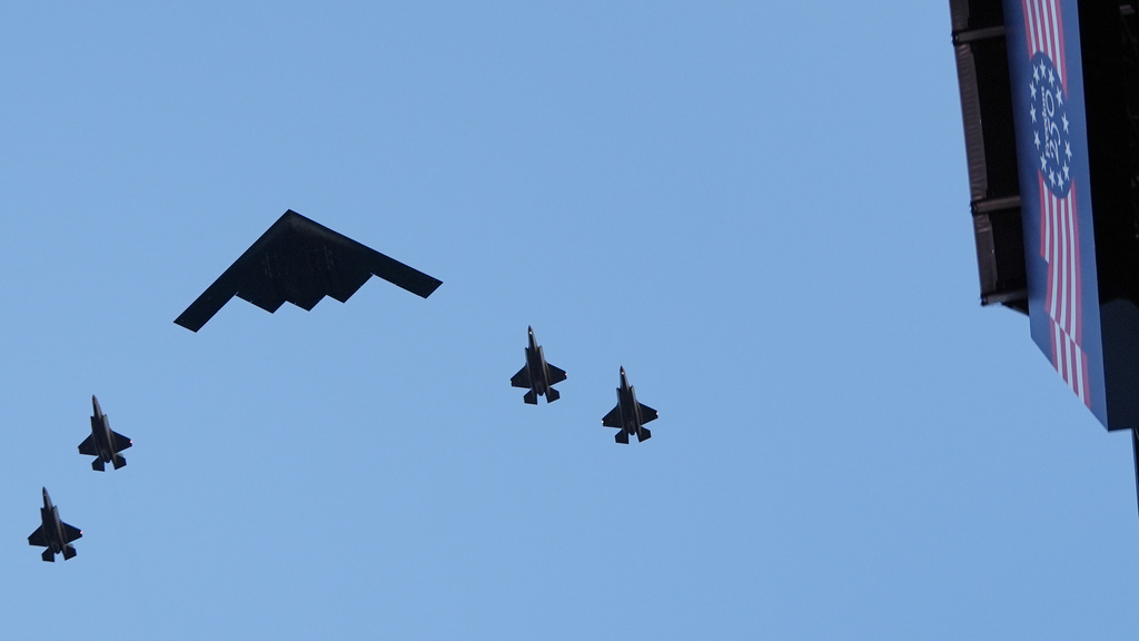 A B-2 stealth bomber and escorts, fly over the opening of the Great American State Fair, Wednesday, June 24, 2026, in Washington. (AP Photo/Jacquelyn Martin)