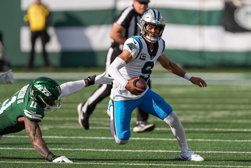 Carolina Panthers quarterback Bryce Young (9) avoids a tackle from New York Jets linebacker Jermaine Johnson II (11) during the second quarter of an NFL football game, Sunday, Oct. 19, 2025, in East Rutherford, N.J. (AP Photo/Seth Wenig) Carolina Panthers quarterback Bryce Young (9) avoids a tackle from New York Jets linebacker Jermaine Johnson II (11) during the second quarter of an NFL football game, Sunday, Oct. 19, 2025, in East Rutherford, N.J. (AP Photo/Seth Wenig)