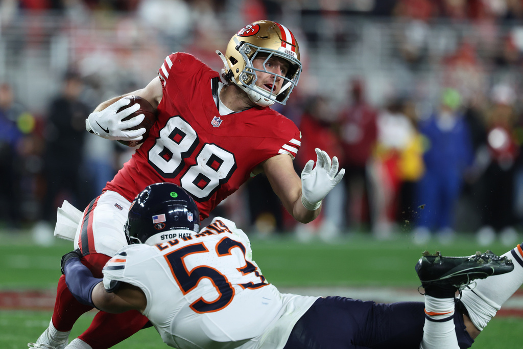 San Francisco 49ers tight end Jake Tonges (88) runs against Chicago Bears linebacker T.J. Edwards (53) during the second half of an NFL football game in Santa Clara, Calif., Sunday, Dec. 28, 2025. (AP Photo/Jed Jacobsohn)