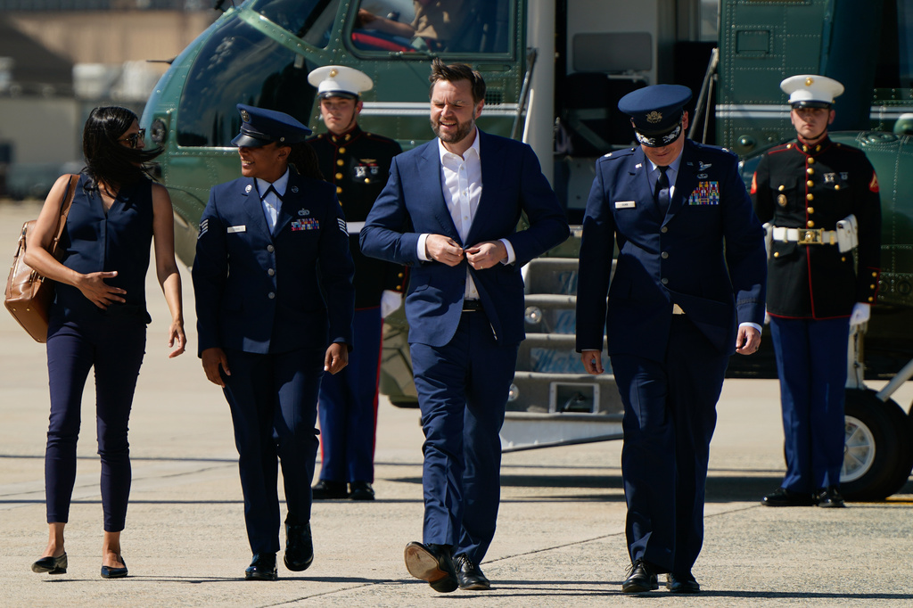 Vice President JD Vance, center, and second lady Usha Vance, left, walk from Marine Two as they arrive at Joint Base Andrews, Md., Saturday, June 20, 2026, en route to Switzerland. (Elizabeth Frantz/Pool Photo via AP)
