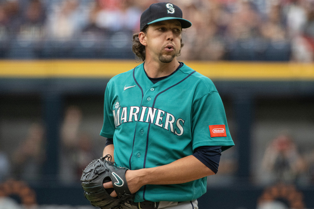 Seattle Mariners starting pitcher Logan Gilbert pauses before delivering against the Cleveland Guardians during the first inning of a baseball game, Saturday, June 27, 2026, in Cleveland. (AP Photo/Phil Long)