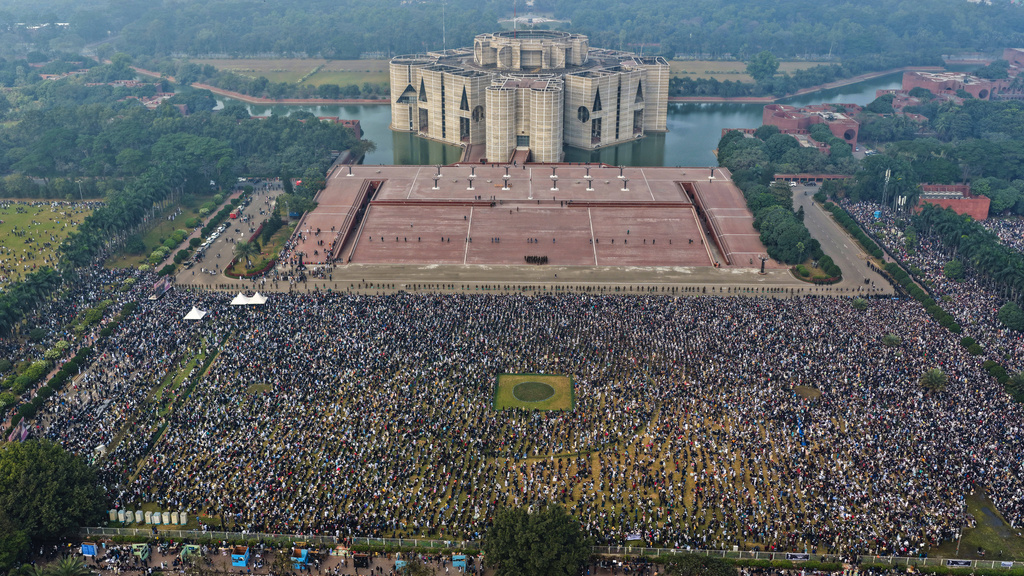 Thousands of people gather to attend funeral prayers for former Prime Minister Khaleda Zia outside the national Parliament building in Dhaka, Bangladesh, Wednesday, Dec. 31, 2025. (AP Photo/Mahmud Hossain Opu)