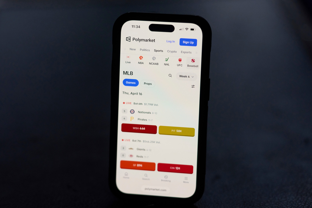 A phone displays sports trades on Polymarket on Thursday, April 16, 2026, in Portland, Ore. (AP Photo/Jenny Kane)