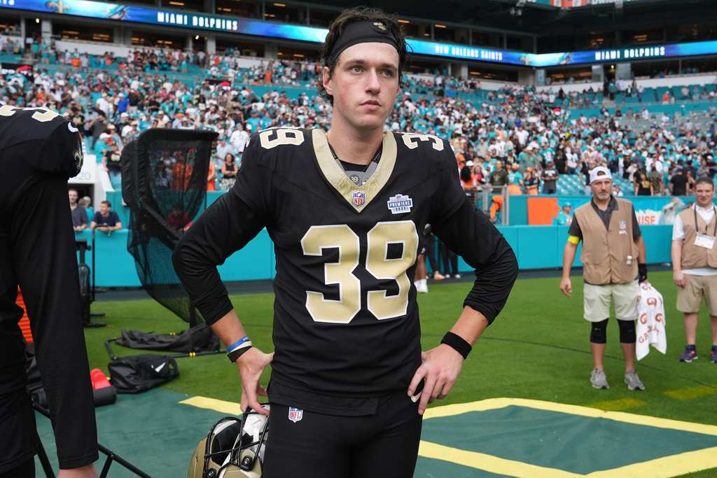 New Orleans Saints place kicker Charlie Smyth (39) stands on the field at the end of an NFL football game against the Miami Dolphins Sunday, Nov. 30, 2025, in Miami Gardens, Fla. (AP Photo/Lynne Sladky)