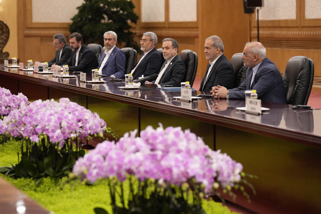 Iranian President Masoud Pezeshkian, second right, speaks with Chinese President Xi Jinping, not in photo, at the Great Hall of the People in Beijing, China, Tuesday, Sept. 2, 2025. (Parker Song/Pool Photo via AP)