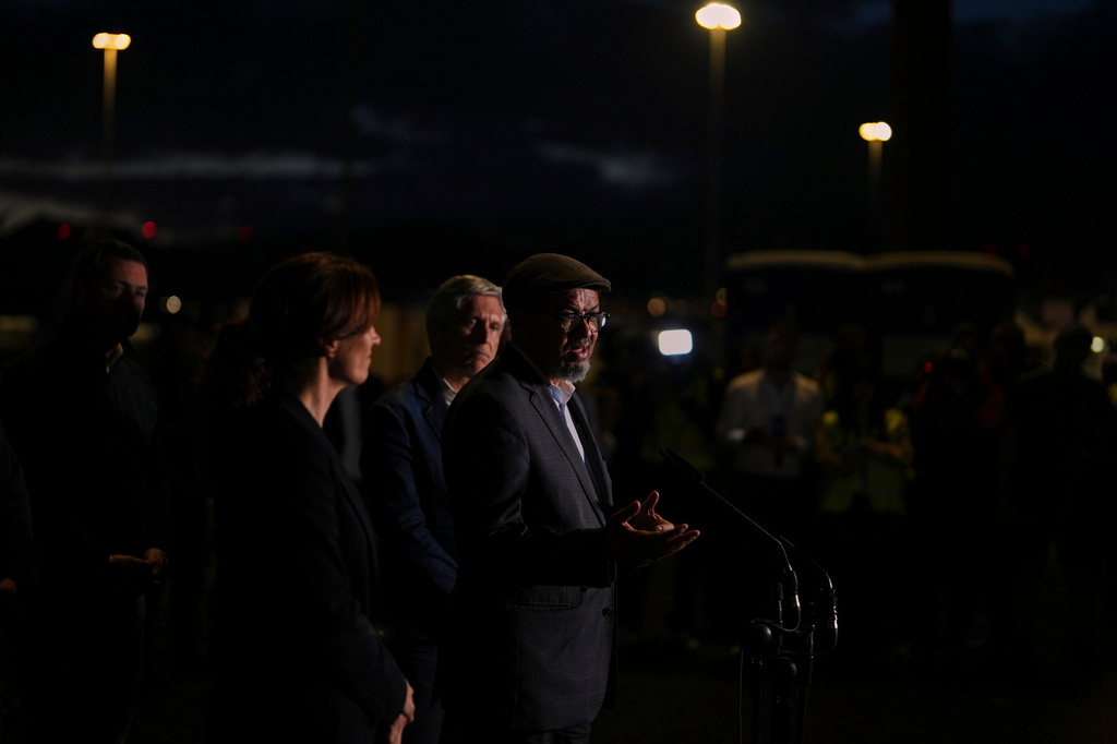 Tedros Adhanom Ghebreyesus, Director-General of the World Health Organization, speaks to the media near the area where passengers from the MV Hondius are expected to arrive at the port of Port of Granadilla in Tenerife, Saturday, May 9, 2026. (AP Photo/Manu Fernandez)