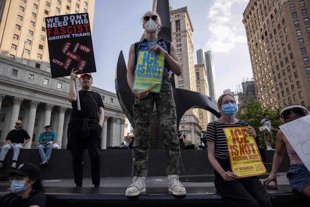 FILE - Demonstrators hold signs and chant during a protest against deportations by Immigration and Customs Enforcement in New York, June 11, 2025. (AP Photo/Yuki Iwamura, File)