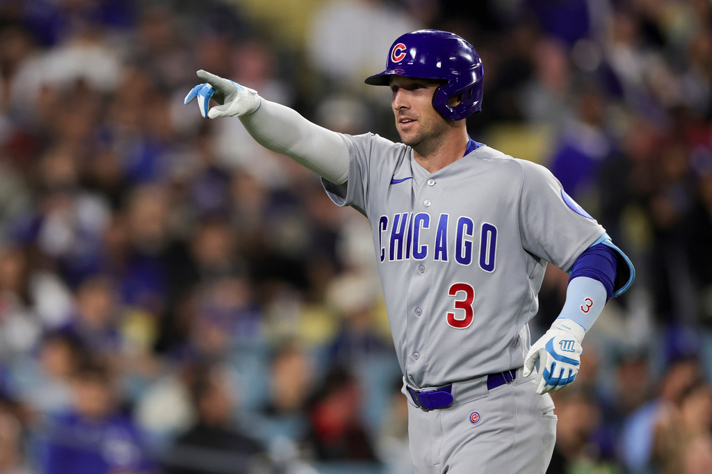Chicago Cubs' Alex Bregman reacts after hitting the tying solo home run during the eighth inning of a baseball game against the Los Angeles Dodgers Friday, April 24, 2026, in Los Angeles. (AP Photo/Ryan Sun)