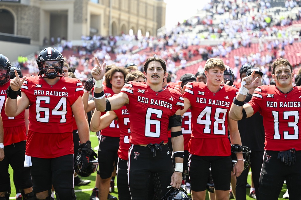 Texas Tech players stands for the Matador Song after winning an NCAA college football game against Kent State, Saturday, Sept. 6, 2025, in Lubbock, Texas. (AP Photo/Justin Rex)