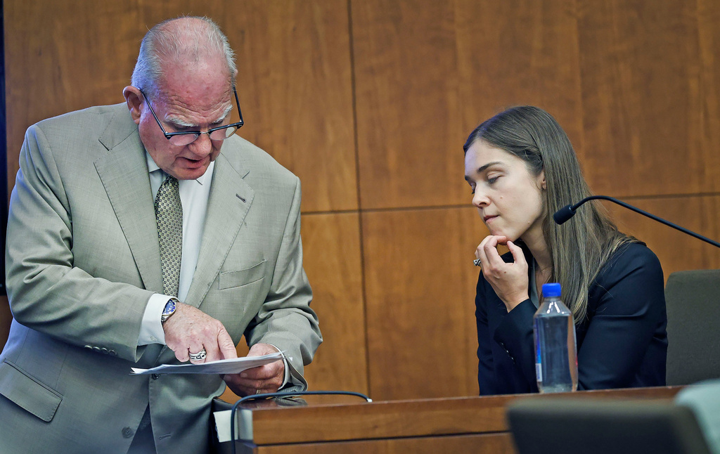 Defense attorney Kevin Reddington, left, questions psychiatrist Dr. Jennifer Tufts about her hand written notes during a session with Lindsay Clancy during Clancy's murder trial at Plymouth Superior Court in Plymouth, Mass., Monday, Aug. 10 2026. (Greg Der/The Patriot Ledger via AP, Pool)