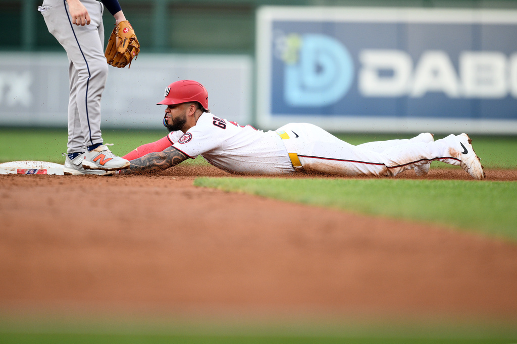 Washington Nationals' Luis Garcia Jr. steals second base during the third inning of a baseball game against the Houston Astros, Wednesday, July 8, 2026, in Washington. (AP Photo/Nick Wass)