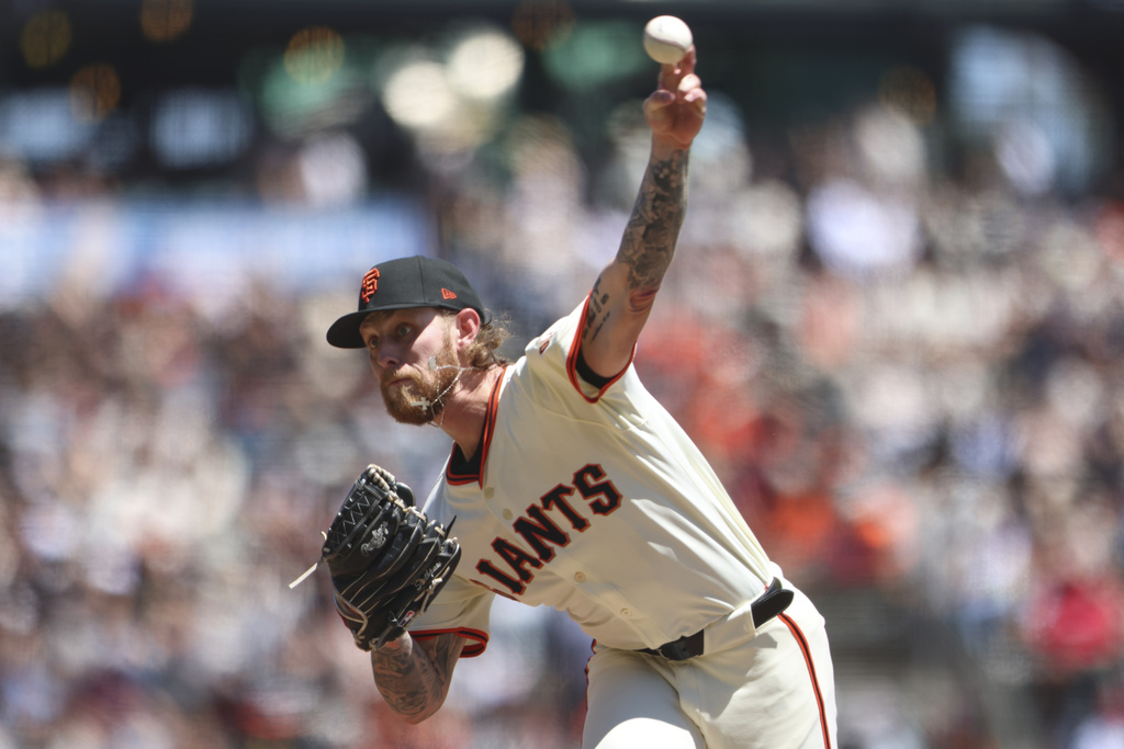 San Francisco Giants starting pitcher Carson Whisenhunt throws to a Washington Nationals batter during the first inning of a baseball game Saturday, Aug. 9, 2025, in San Francisco. (AP Photo/Scott Marshall)