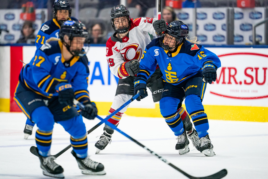 Ottawa Charge forward Peyton Hemp (29) collides with Toronto Sceptres' Savannah Harmon (15) during the first period of aPWHL hockey game in Toronto, Saturday, April 11, 2026. (Arlyn McAdorey/The Canadian Press via AP)