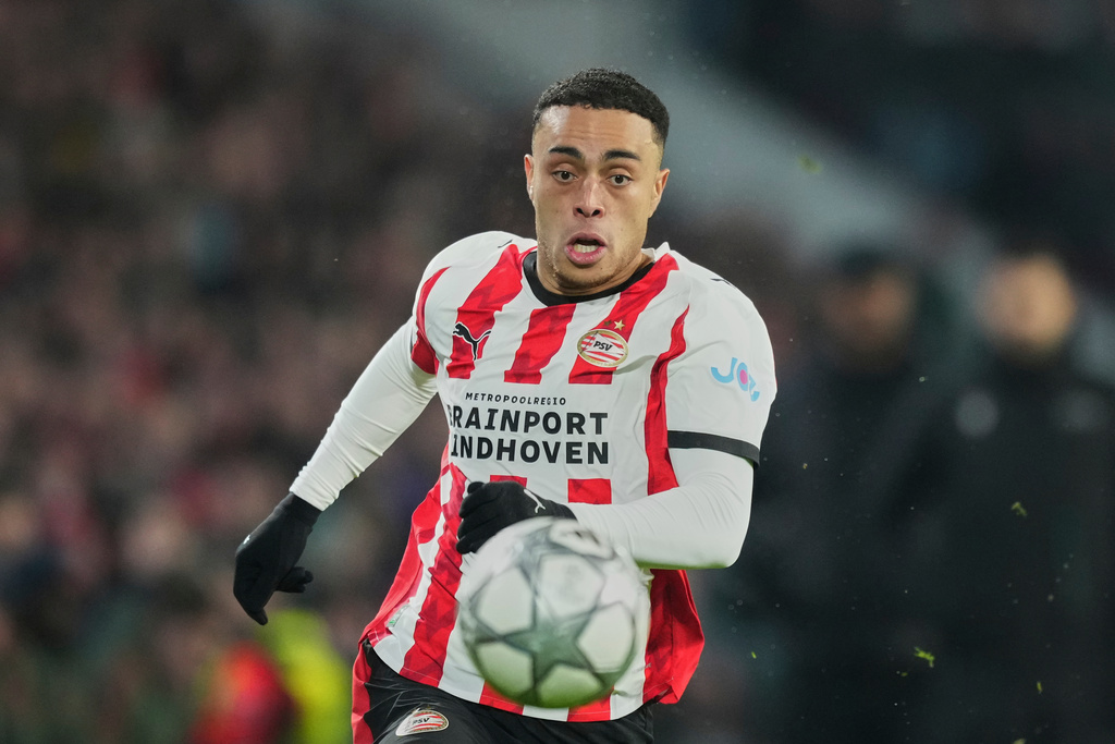 FILE - PSV's Sergino Dest runs with the ball during a Champions League opening phase soccer match between PSV and Bayern Munich in Eindhoven, Netherlands, Jan. 28, 2026. (AP Photo/Peter Dejong, File)