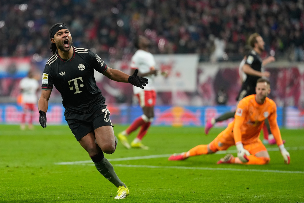 Bayern's Serge Gnabry celebrates after scoring his side's opening goal during the Bundesliga soccer match between RB Leipzig and FC Bayern Munich in Leipzig, Germany, Saturday, Jan. 17, 2026. (AP Photo/Matthias Schrader)
