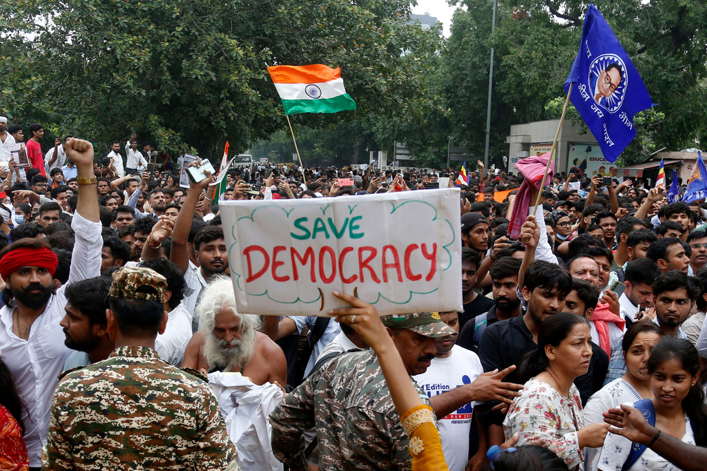 Supporters of the Cockroach Janta Party attempt to march to India's Parliament, demanding the resignation of the education minister, in New Delhi, Monday, July 20, 2026. (AP Photo/Shekhar Yadav)