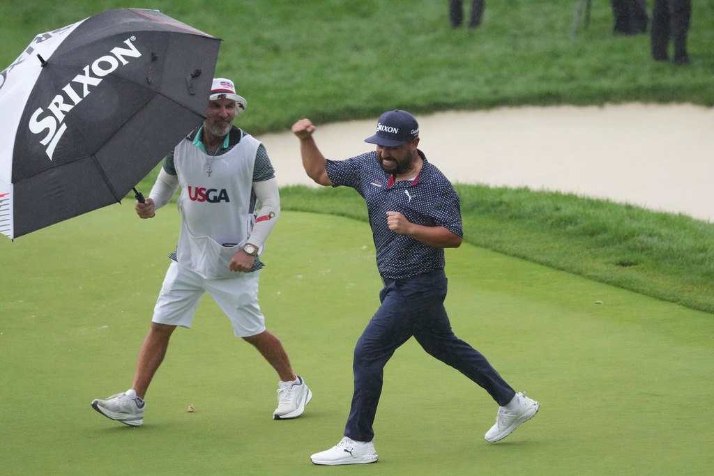 FILE - J.J. Spaun celebrates making a birdie putt on the 18th hole during the final round of the U.S. Open golf tournament at Oakmont Country Club Sunday, June 15, 2025, in Oakmont, Pa. (AP Photo/Gene J. Puskar, file)