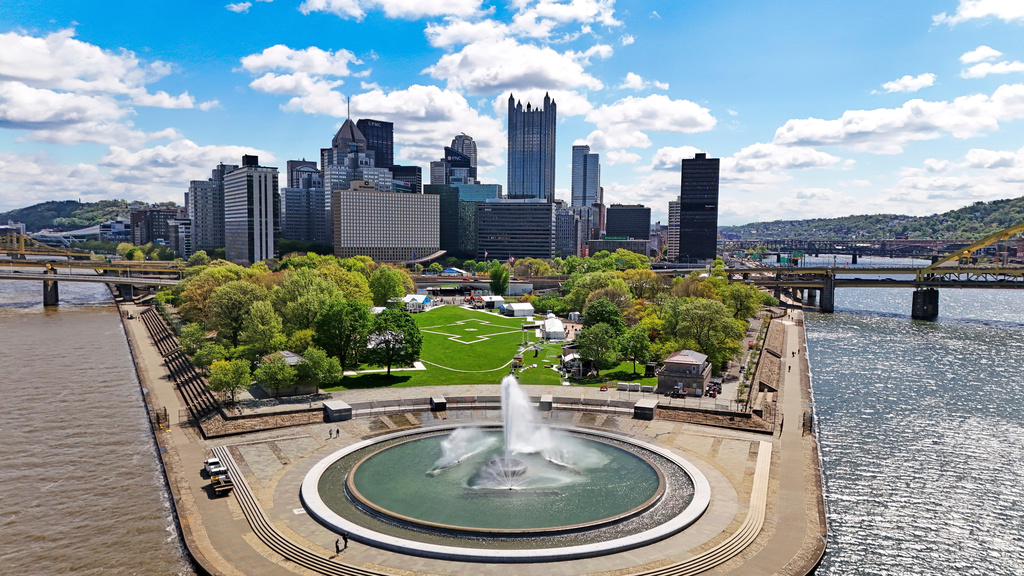 This is Point State Park, where a portion of the 2026 NFL Draft activities with be staged, across the Allegheny River from the NFL Draft stage built outside Acrisure Stadium, on Sunday, April 19, 2026, four days before the first round of the 2026 NFL Draft in Pittsburgh. (AP Photo/Gene J. Puskar)