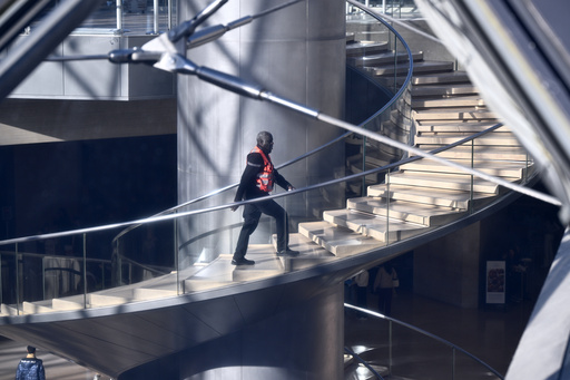 A private member of the security claims up the stairs in the Louvre museum, Thursday, Oct. 30, 2025 in Paris. (AP Photo/Emma Da Silva) A private member of the security claims up the stairs in the Louvre museum, Thursday, Oct. 30, 2025 in Paris. (AP Photo/Emma Da Silva)