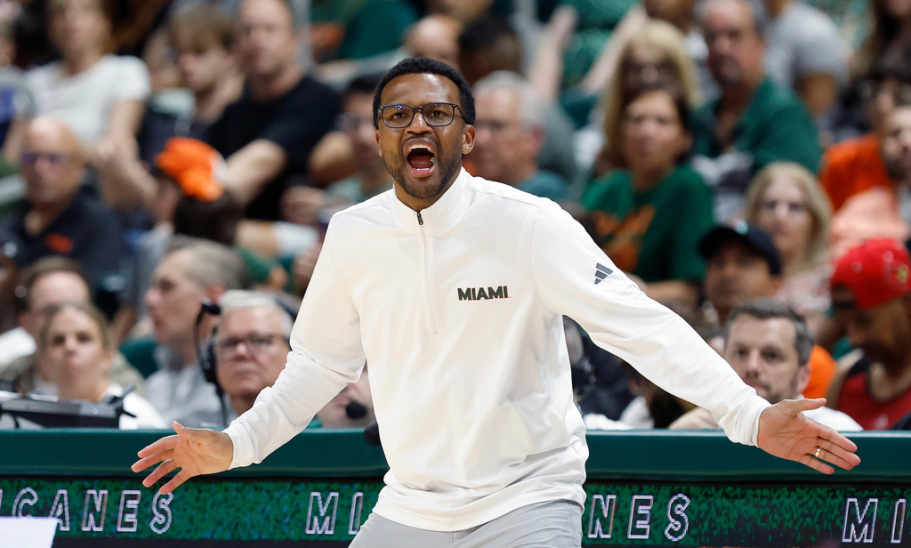 Miami head coach Jai Lucas reacts during the second half of an NCAA college basketball game against Louisville, Saturday, March 7, 2026, in Coral Gables, Fla. (AP Photo/Rhona Wise)