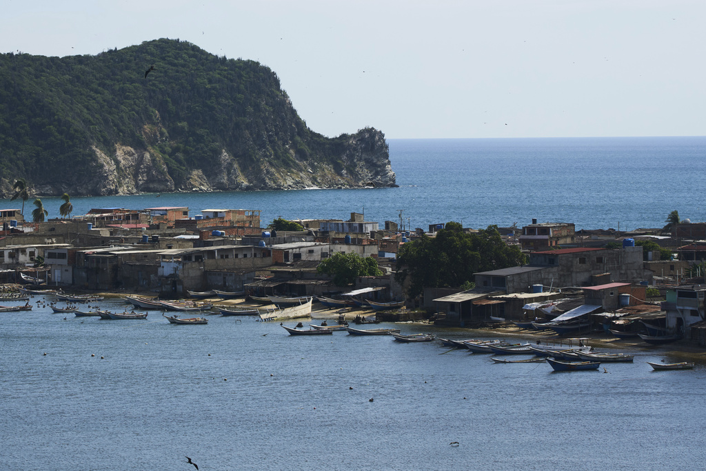 Boats are anchored off El Morro de Puerto Santo, on Venezuela's Paria Peninsula, Sunday, Sept. 14, 2025. (AP Photo/Ariana Cubillos)