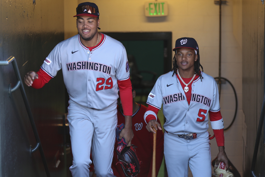 Washington Nationals' James Wood (29) and CJ Abrams (5) walk up the tunnel before a baseball game against the San Francisco Giants, Saturday, Aug. 9, 2025, in San Francisco. (AP Photo/Scott Marshall)