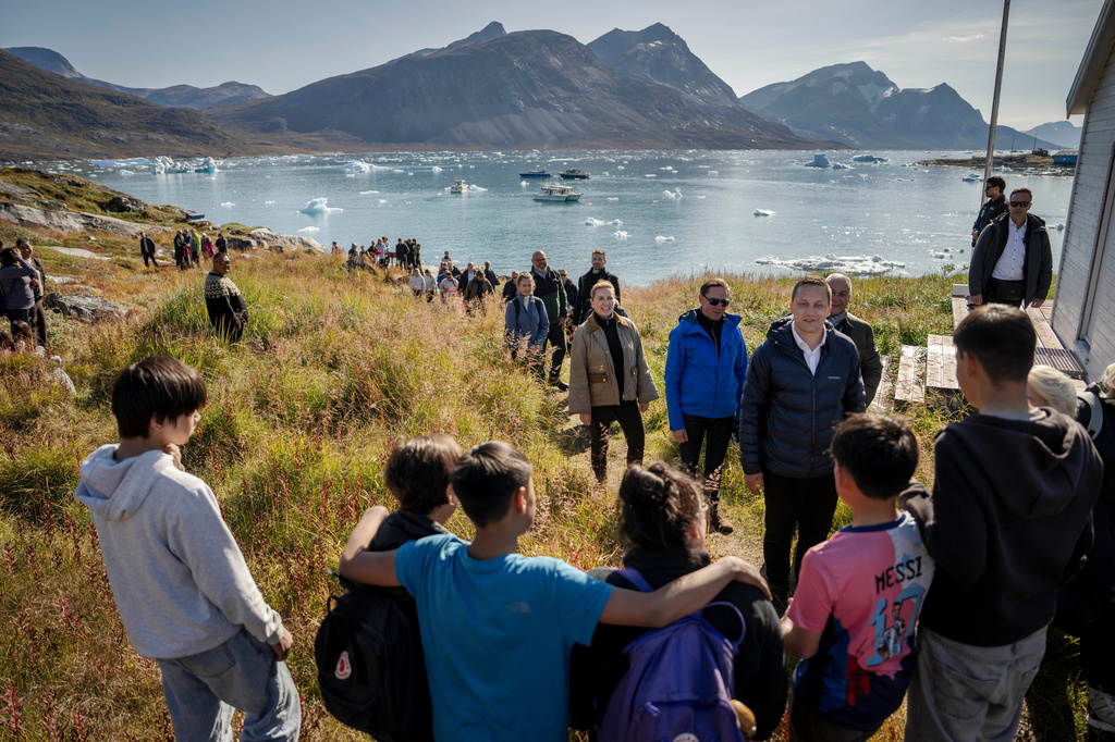 Denmark’s Prime Minister Mette Frederiksen, forth right, and Greenlandic Prime Minister Jens-Frederik Nielsen, front, visit Qoornoq, Greenland Sunday, Sept. 6, 2026. (Mads Claus Rasmussen/Ritzau Scanpix via AP)