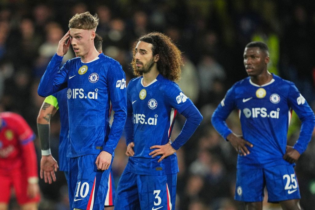Chelsea's Cole Palmer, Chelsea's Marc Cucurella, Chelsea's Moises Caicedo react during the Champions League soccer match between Chelsea and Paris Saint-Germain in London, England, Tuesday, March 17, 2026. (AP Photo/Kin Cheung)