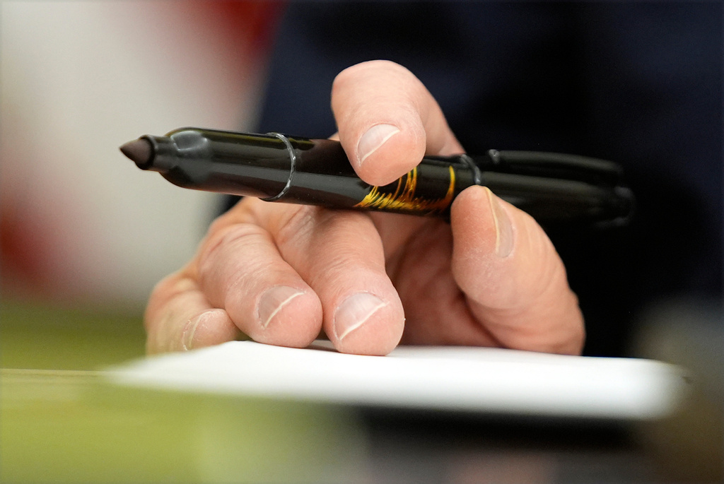 FILE - President Donald Trump signs executive orders in the Oval Office of the White House, Jan. 20, 2025, in Washington. (AP Photo/Evan Vucci, File)