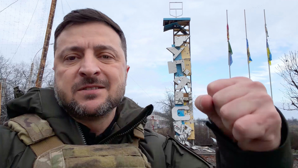 In this image made from a video provided by the Press Service of the President of Ukraine on Friday, Dec. 12, 2025, Ukraine's President Volodymyr Zelenskyy records a video at the entrance of a road in Kupiansk, Ukraine. (Press Service of the President of Ukraine, via AP)