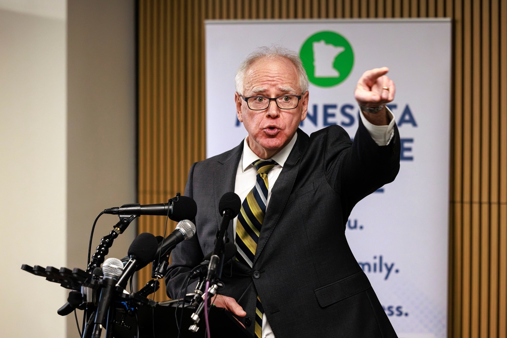 Minnesota Gov. Tim Walz responds to questions from reporters regarding whether he will seek a third term during a press conference following an event on the state's new Paid Family and Medical Leave program, Tuesday, Jan. 6, 2026, in Minneapolis. (Kerem Yücel/Minnesota Public Radio via AP)