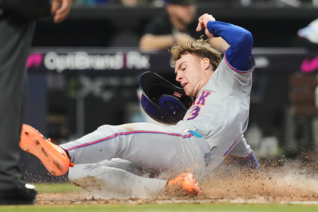New York Mets' Carson Benge scores on a double hit by Marcus Semien during the sixth inning of a baseball game against the Miami Marlins, Monday, Sept. 7, 2026, in Miami. (AP Photo/Lynne Sladky)