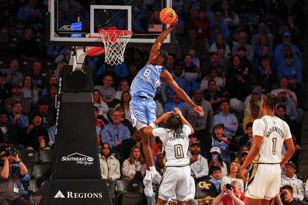 North Carolina forward Caleb Wilson (8) dunks over Georgia Tech guard Akai Fleming (0) during the first half of an NCAA college basketball game, Saturday, Jan. 31, 2026, in Atlanta. (AP Photo/Colin Hubbard)