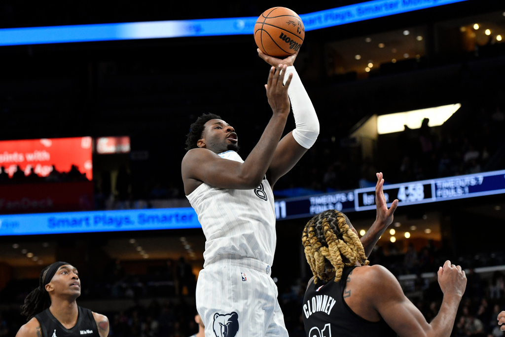 Memphis Grizzlies forward Jaren Jackson Jr. shoots over Brooklyn Nets forward Noah Clowney in the first half of an NBA basketball game, Sunday, Jan. 11, 2026, in Memphis, Tenn. (AP Photo/Brandon Dill)