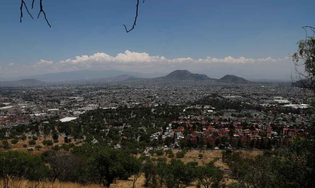 FILE - A view of Mexico City as seen from the Iztapalapa neighborhood, April 30, 2020. (AP Photo/Marco Ugarte, File)