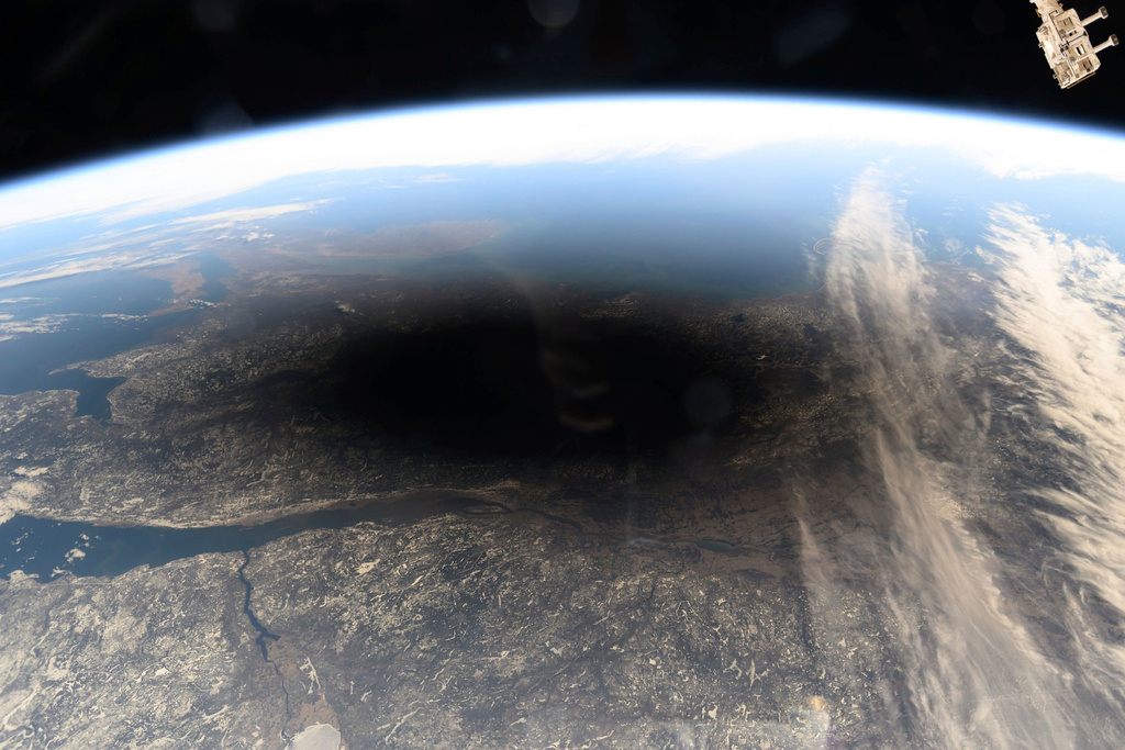 CORRECTS MONTH FILE - This photo provided by NASA shows the Moon's shadow covering portions of Canada and the U.S. during a total solar eclipse as seen from the International Space Station, on Monday, April 8, 2024. (NASA via AP, File)