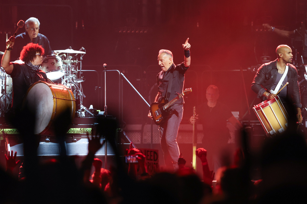Max Weinberg, from left, Jake Clemons, Bruce Springsteen, and Anthony Almonte of Bruce Springsteen and the E Street Band perform on opening night of the "Land of Hope And Dreams" tour at Target Center in Minneapolis. (AP Photo/Ellen Schmidt)