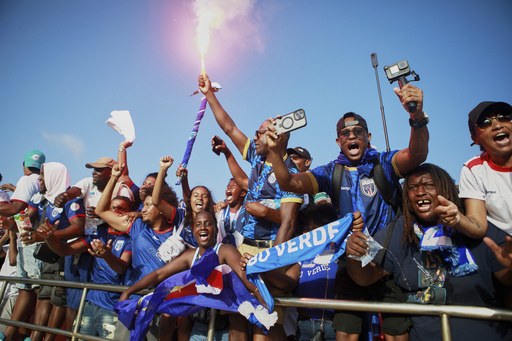 Fans celebrate in the stands after Cape Verde defeated Eswatini in a World Cup qualifying soccer match at Estádio Nacional in Praia, Cape Verde, Monday, Oct. 13, 2025, to clinch their qualification for the 2026 World Cup. (AP Photo/Cristiano Barbosa) Fans celebrate in the stands after Cape Verde defeated Eswatini in a World Cup qualifying soccer match at Estádio Nacional in Praia, Cape Verde, Monday, Oct. 13, 2025, to clinch their qualification for the 2026 World Cup. (AP Photo/Cristiano Barbosa)