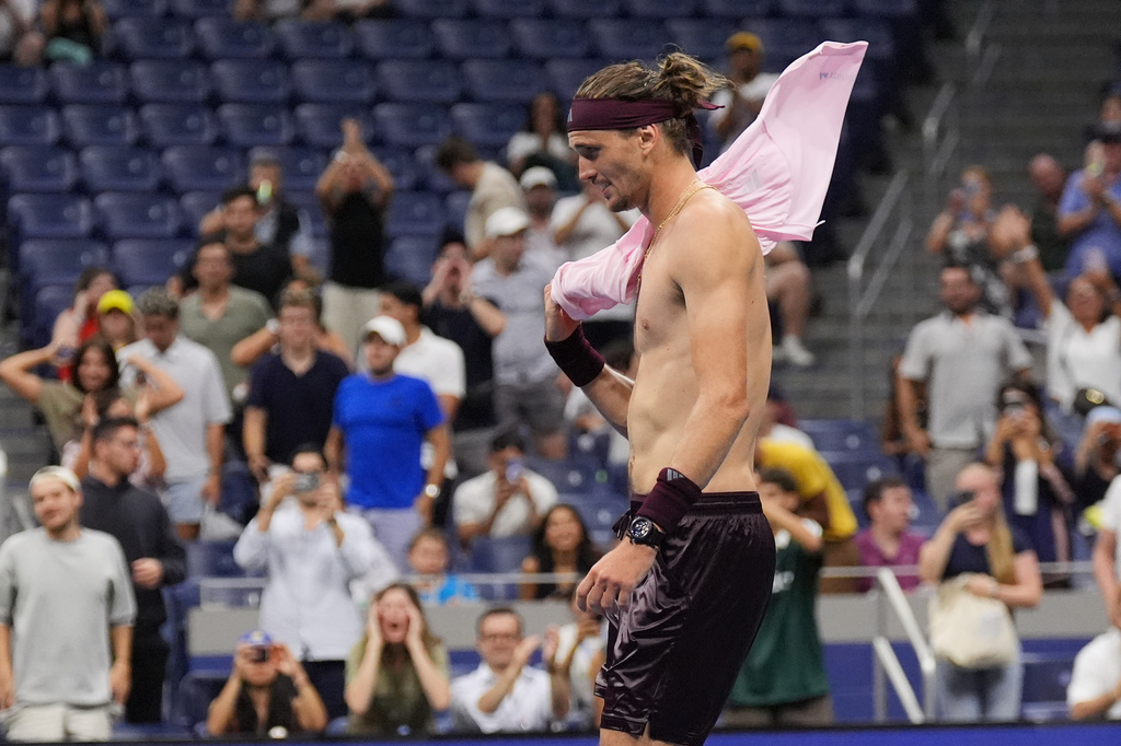 Alexander Zverev, of Germany, celebrates after defeating Quentin Halys, of France, in five sets in the the second round of the U.S. Open tennis championships, early Friday, Sept. 4, 2026, in New York. (AP Photo/Frank Franklin II)