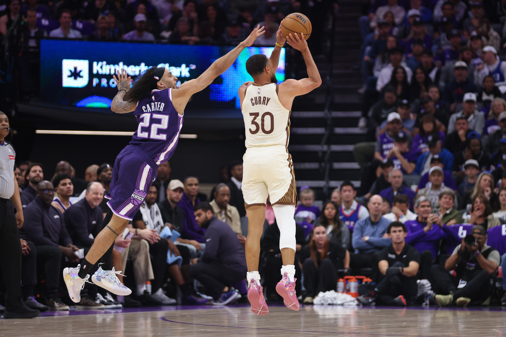 Golden State Warriors guard Stephen Curry (30) attempts a three point basket during the first half of an NBA basketball game against the Sacramento Kings Friday, April 10, 2026, in Sacramento, Calif. (AP Photo/Scott Marshall)