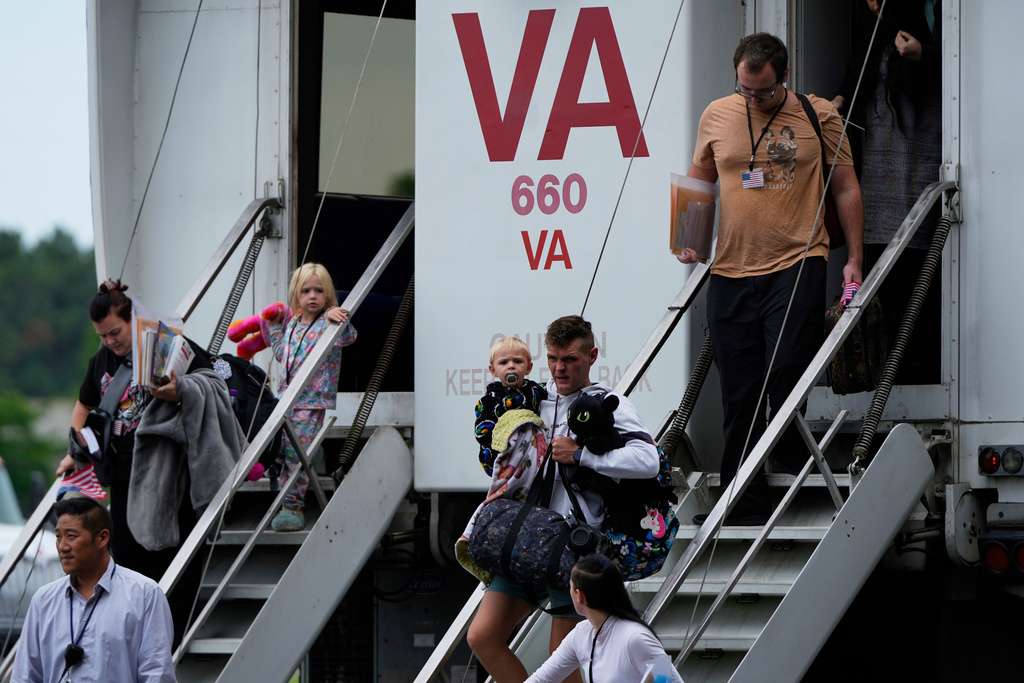 FILE - Refugees from South Africa, arrive Monday, May 12, 2025, at Dulles International Airport in Dulles, Va. (AP Photo/Julia Demaree Nikhinson, File)