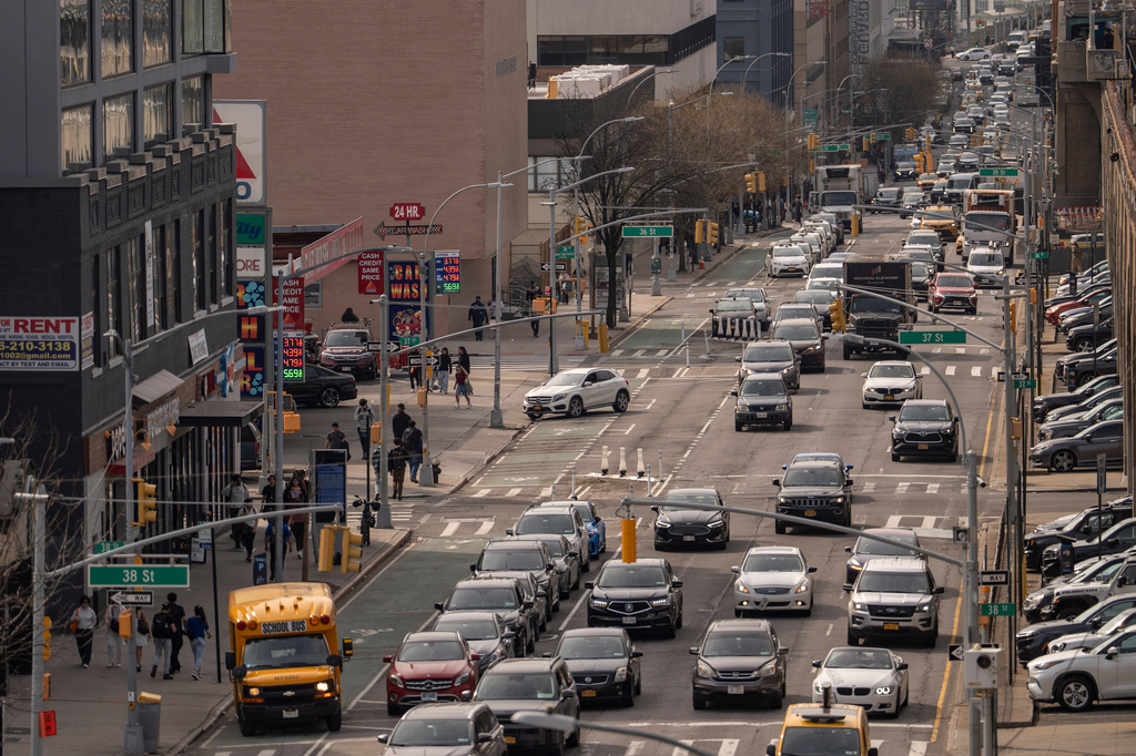 Vehicles drive past a CITGO gas station in the Queens borough of New York, Tuesday, March 31, 2026. (AP Photo/Yuki Iwamura)